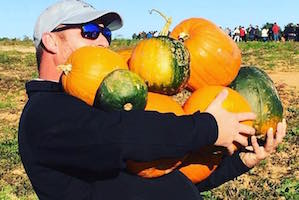 Erin's husband doing the Ashland Berry Farm "All You Can Carry" for $20.