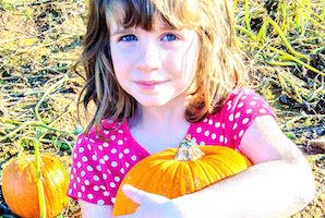 Liz's kids like to play in the giant tub of corn and run through the kiddie haunted house. 